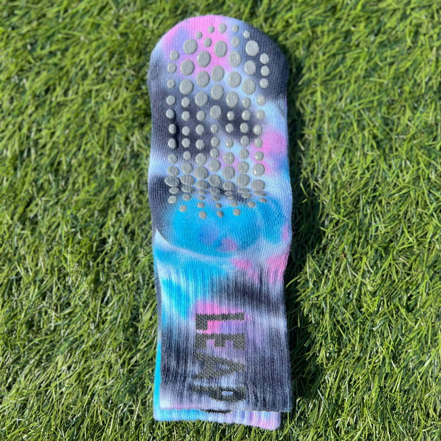 The Underside of toddler socks with grey spot grip details.