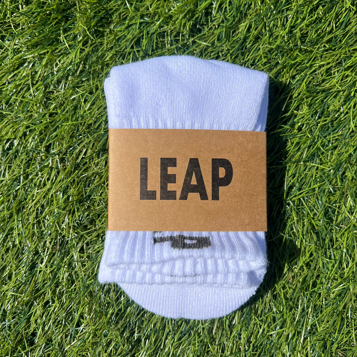 white LEAP socks in packaging.