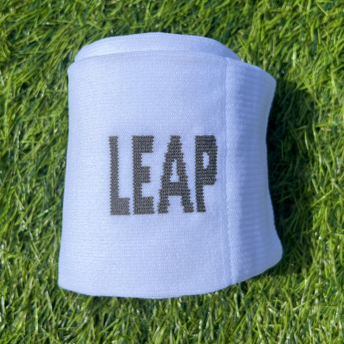 Rolled-up fooball sock showing the LEAP logo.