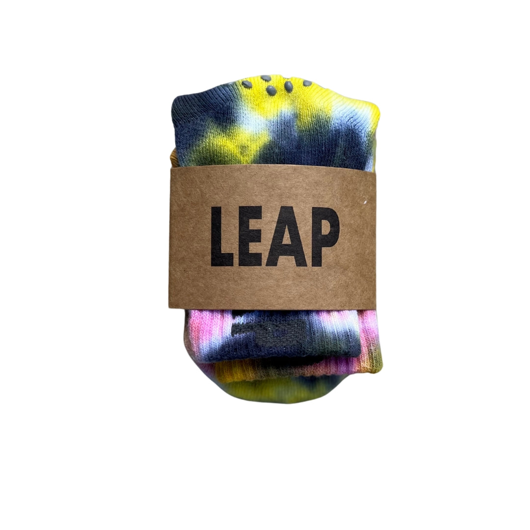Tie-dye toddler socks in brown recycled packaging.