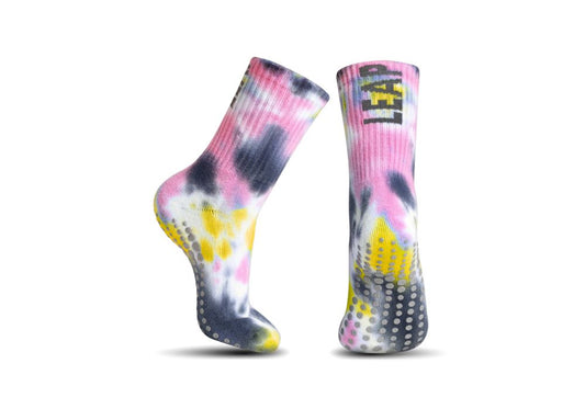 Colorful tie-dye socks with yellow accents on a white background